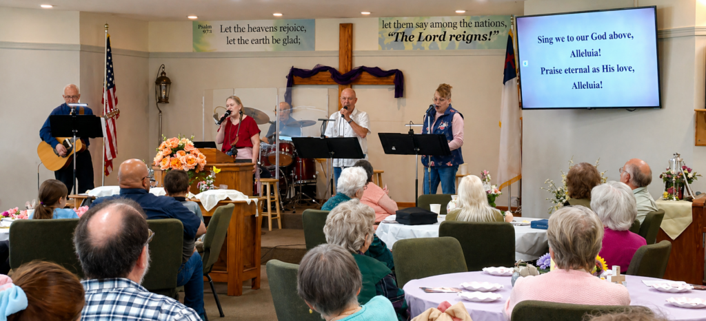 Worship service at Grace Baptist Church in Dallas Oregon with congregation and live music