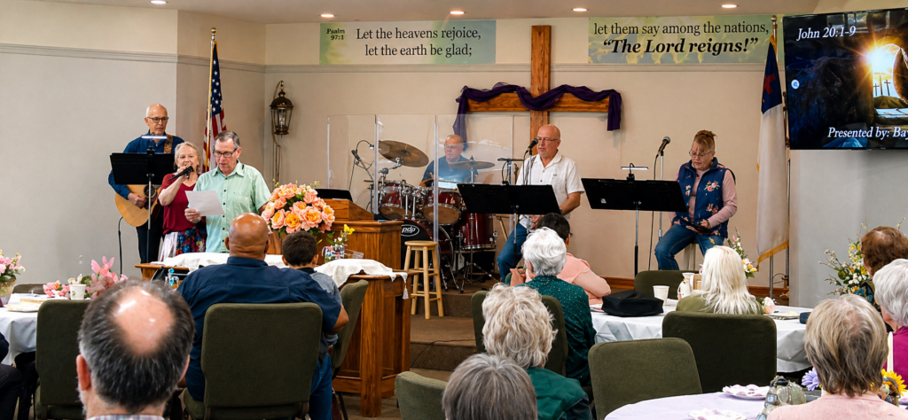Congregation worshipping during a service at Grace Baptist Church in Dallas Oregon with live music and teaching