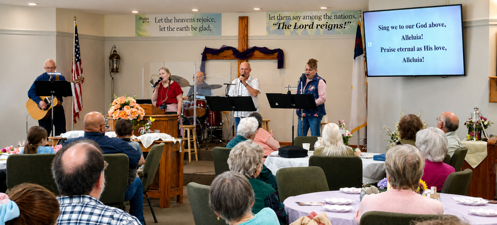 Worship service at Grace Baptist Church in Dallas Oregon with congregation and live music
